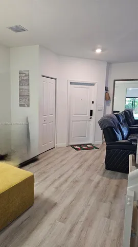 a spacious bedroom with a bed and furniture