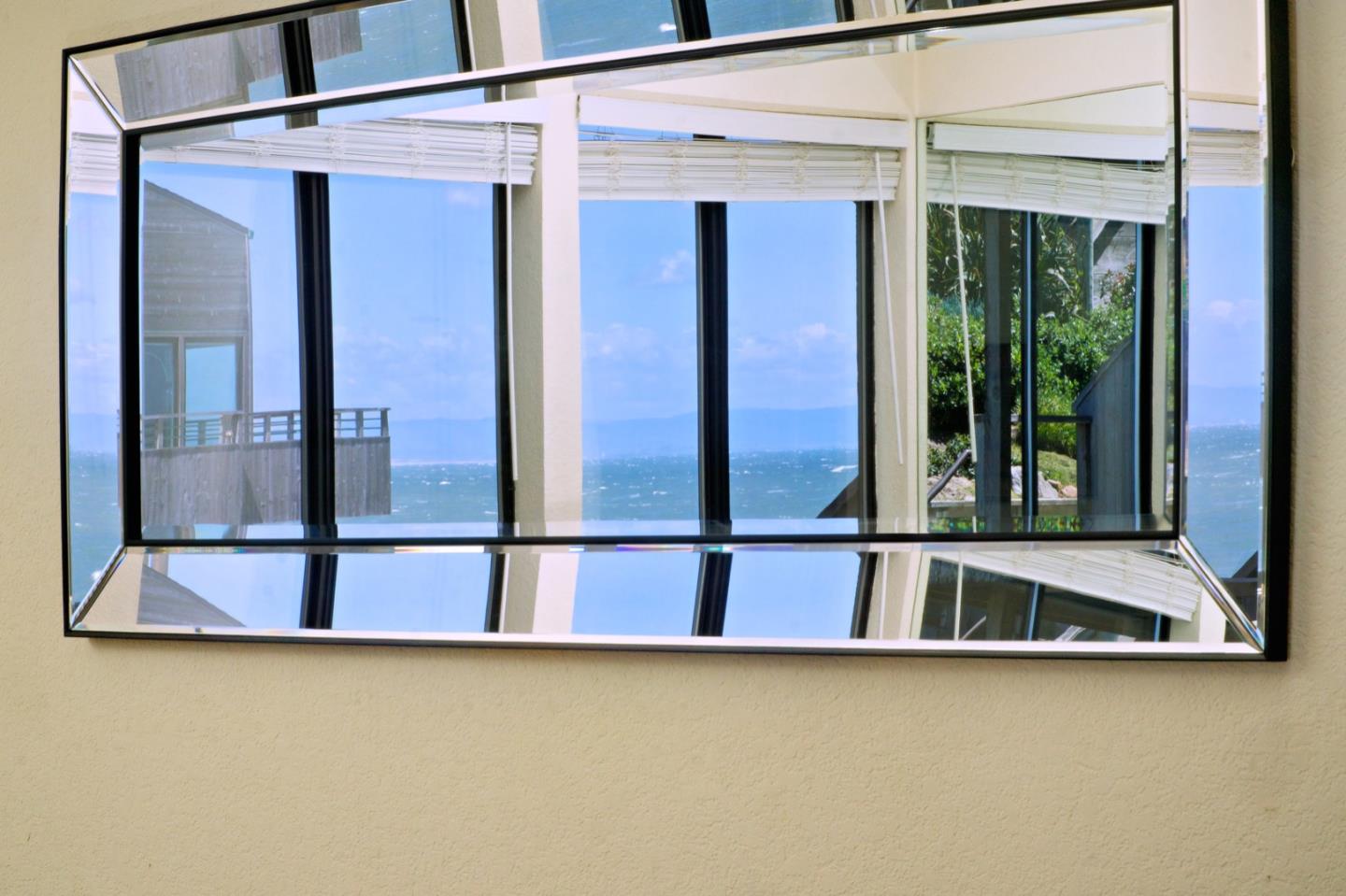 1 Surf Way, Unit 125 Monterey, CA 93940 - Photo 11 of 36 a view of a balcony with furniture and floor to ceiling window