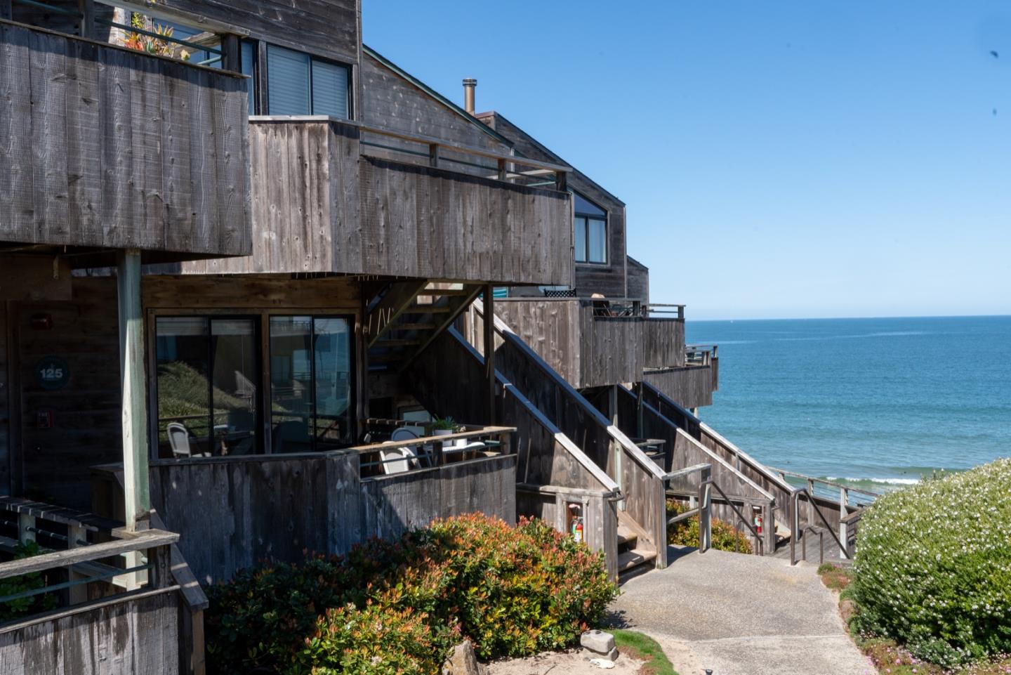 1 Surf Way, Unit 125 Monterey, CA 93940 - Photo 22 of 36 a view of a house with a yard