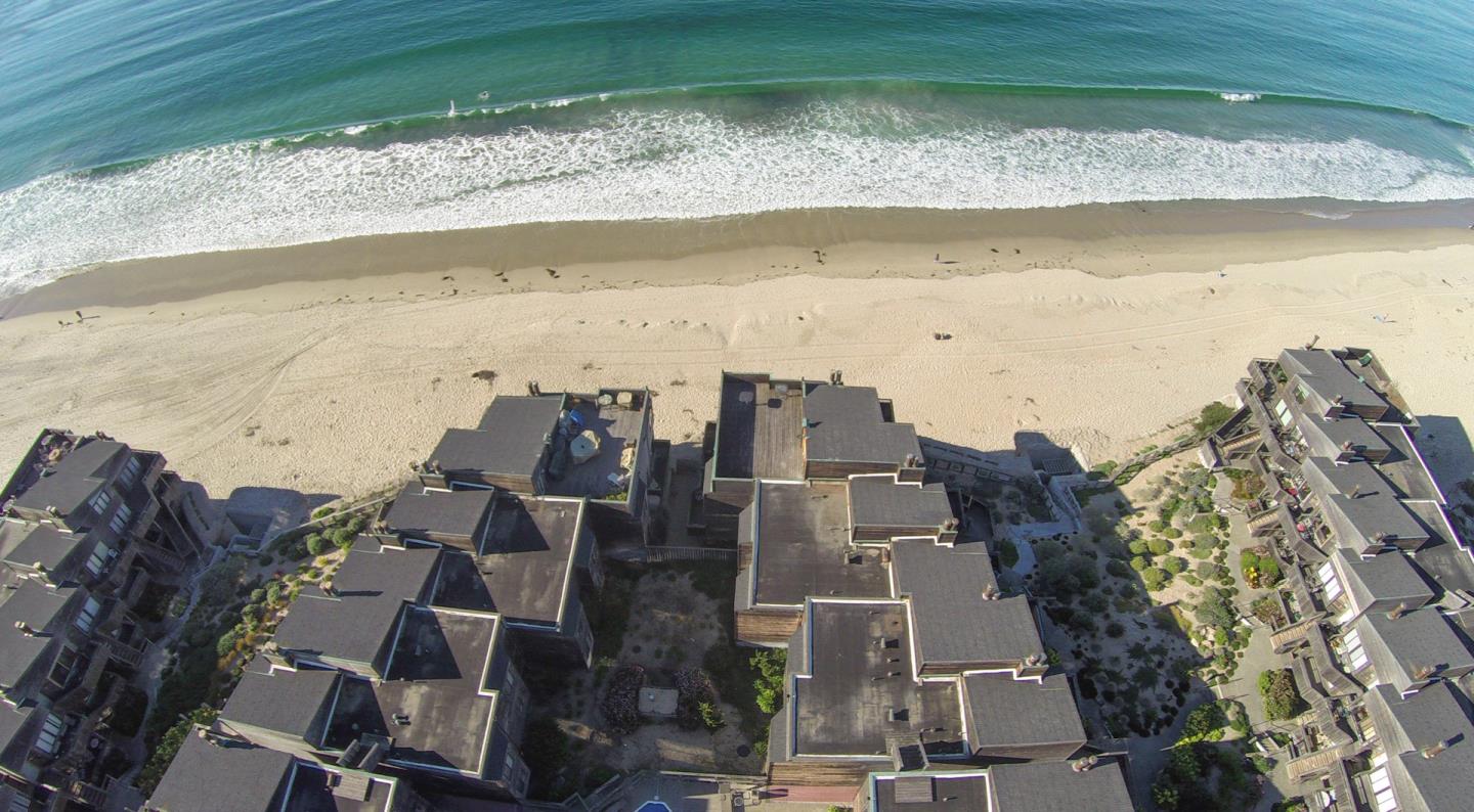 1 Surf Way, Unit 125 Monterey, CA 93940 - Photo 25 of 36 a view of a lake with a beach