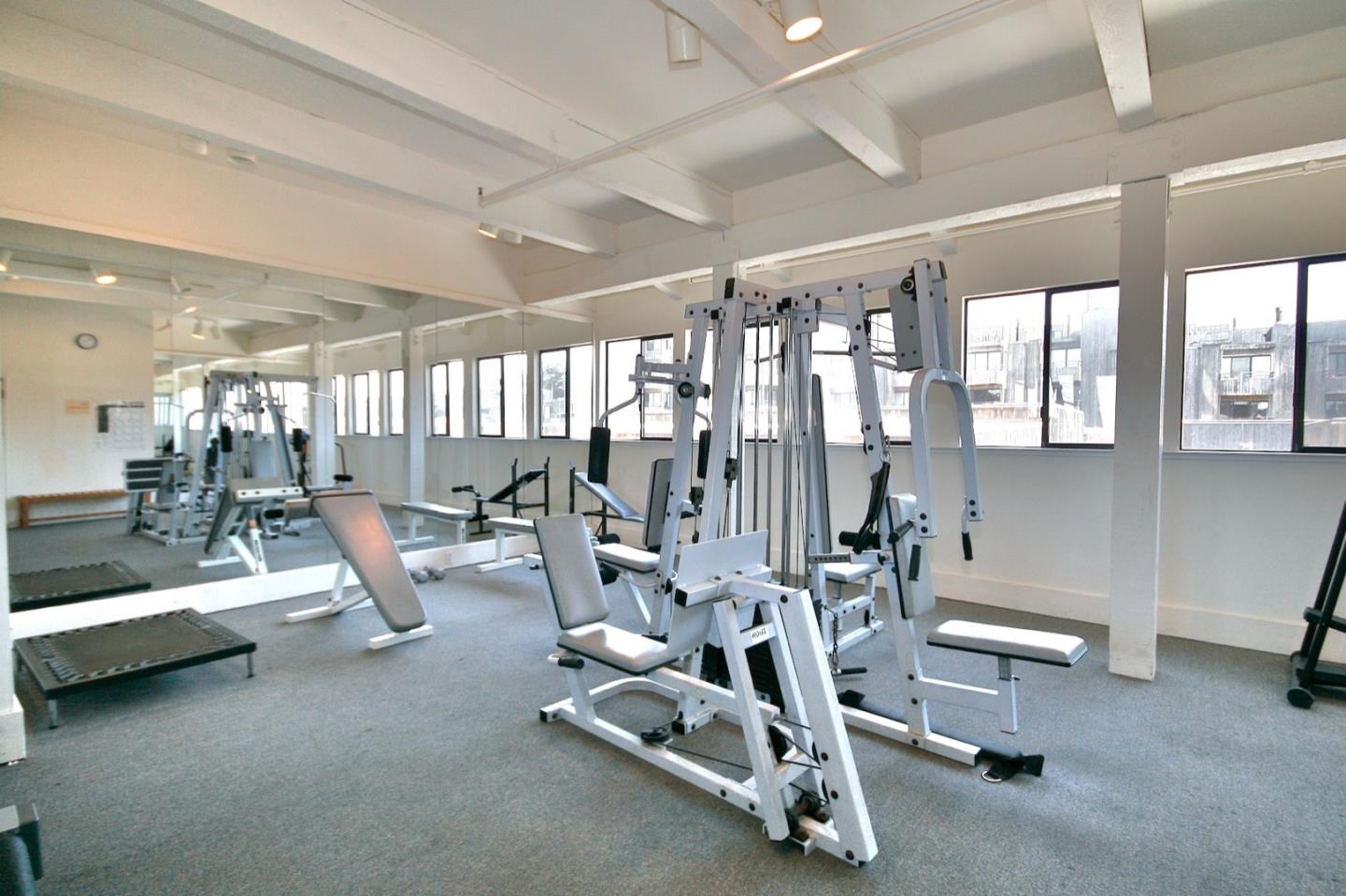1 Surf Way, Unit 125 Monterey, CA 93940 - Photo 27 of 36 a view of a room with gym equipment