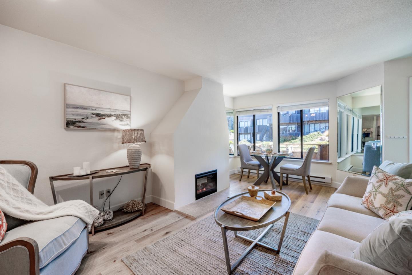 1 Surf Way, Unit 125 Monterey, CA 93940 - Photo 6 of 36 a living room with furniture and a wooden floor