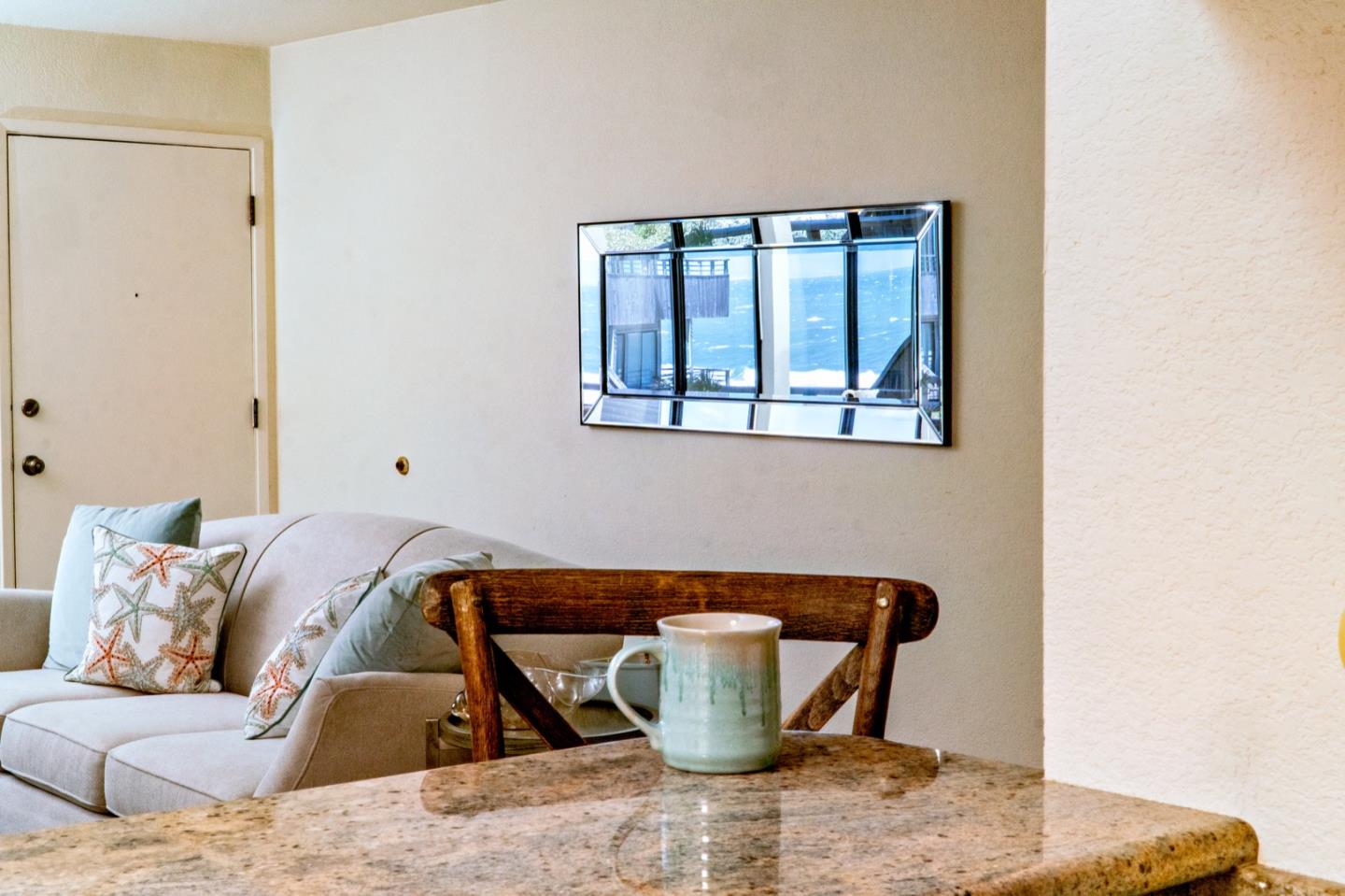 1 Surf Way, Unit 125 Monterey, CA 93940 - Photo 10 of 36 a living room with a couch