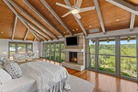 a bed room with a bed and a television