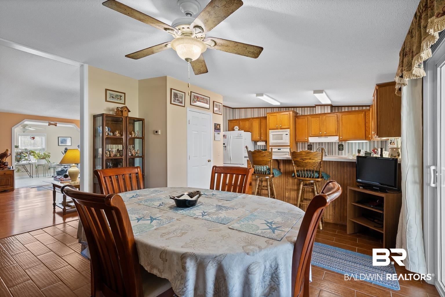 10647 Rte Road Lillian, AL 36549 - Photo 33 of 62 Dining space with ceiling fan and wood finish floors