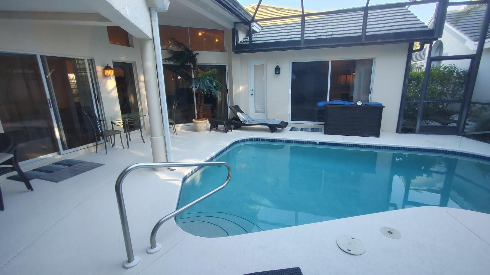 16461 Riverwind Drive Jupiter, FL 33477 - Photo 39 of 45 a bathroom with a tub sink and mirror