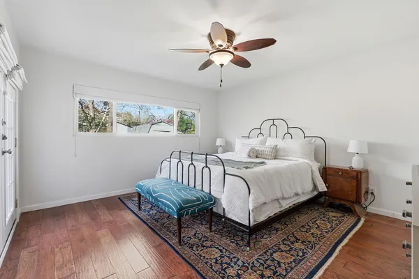 a bedroom with a bed and window