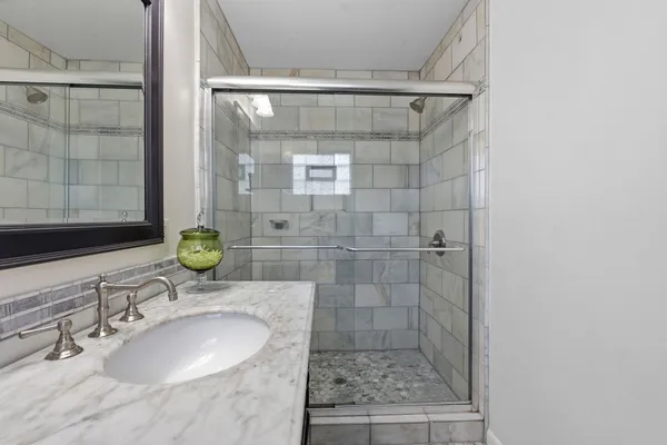 a bathroom with a sink and a mirror