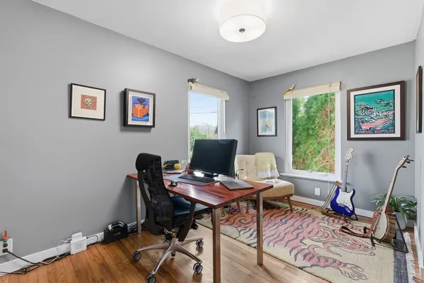 a workspace with furniture and a window