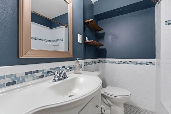 a bathroom with a sink and a toilet