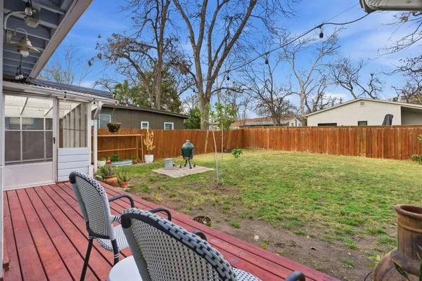 a view of a backyard with a sitting area