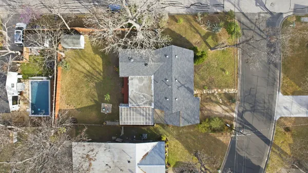 a aerial view of residential houses with outdoor space