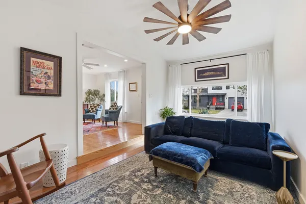 a living room with furniture and a rug