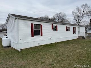 115 Winding Wood Road Hopewell Junction, NY 12533 - Photo 2 of 17 a view of a house with backyard