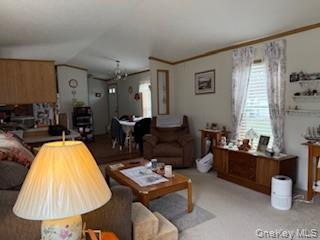 115 Winding Wood Road Hopewell Junction, NY 12533 - Photo 9 of 17 a living room with furniture and a lamp