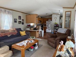 115 Winding Wood Road Hopewell Junction, NY 12533 - Photo 10 of 17 a living room with furniture kitchen view and a window