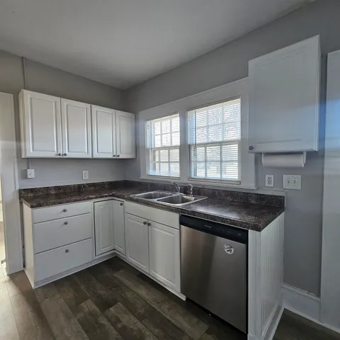 a kitchen with a sink and cabinets