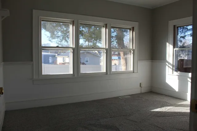 a view of an empty room with a window