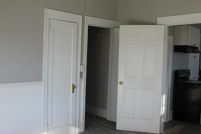 a view of walk in closet with empty racks