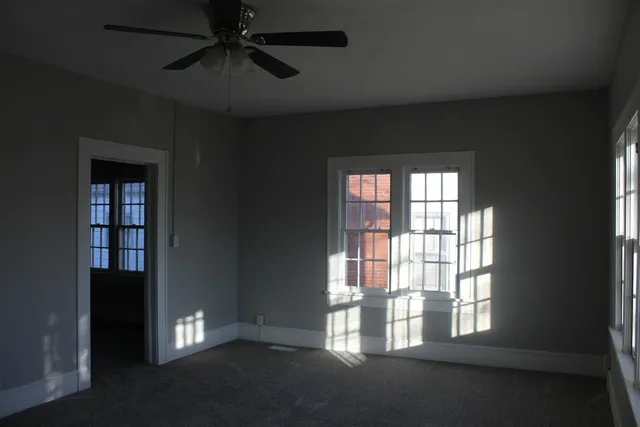 a view of an empty room with a window