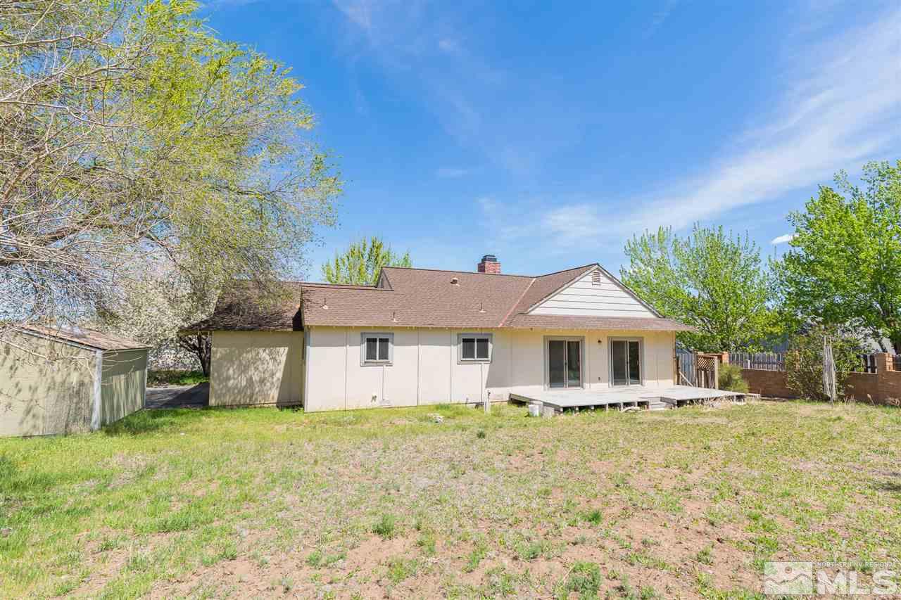10050 Broken Hill Road Reno, NV 89511 - Photo 23 of 23 a front view of a house with a large tree
