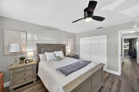 a bed room with a bed and a lamp
