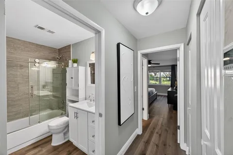 a bathroom with a glass shower door