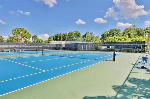 a view of an outdoor space and tennis court