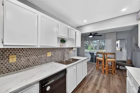 a kitchen with a sink and cabinets
