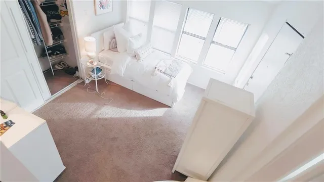 a view of a living room with furniture and a fireplace