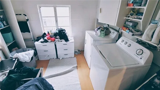 a utility room with toys and wooden floor