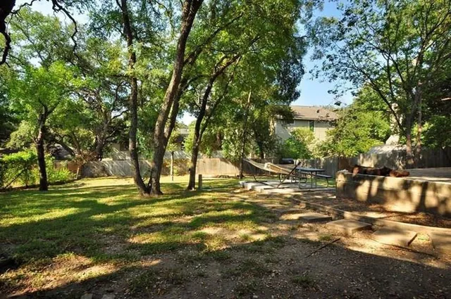 a view of a yard with a tree