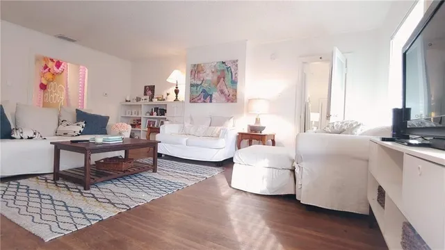 a living room with furniture and a table