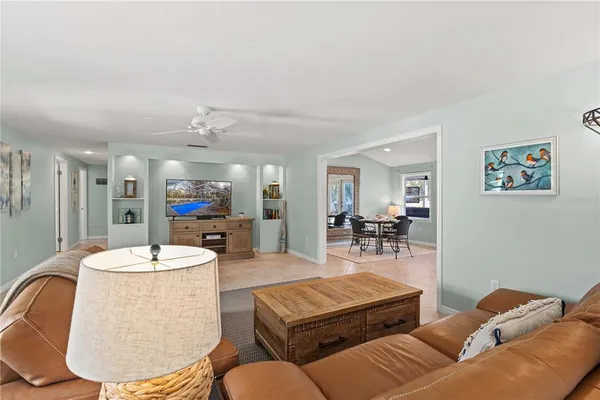 a living room with lots of furniture and a table
