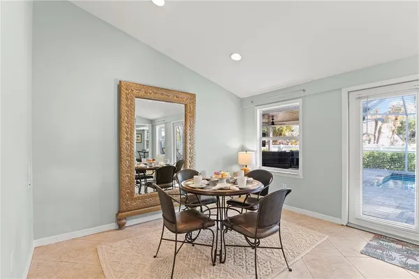a living room with furniture and a chair
