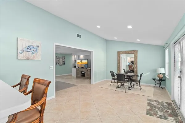 a dining room with furniture and window