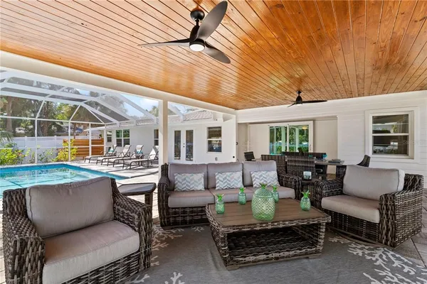 a view of swimming pool with seating area