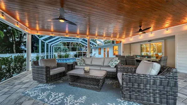 a view of a house with a yard and sitting area