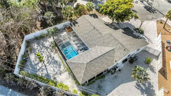 an aerial view of a house with outdoor space