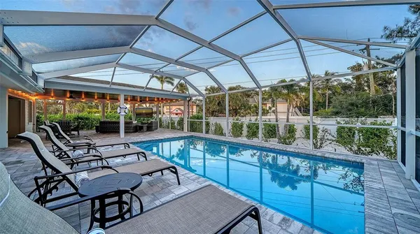 a view of a swimming pool with a patio