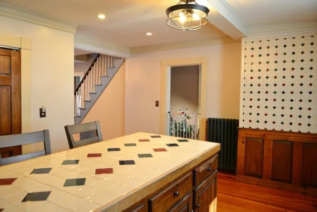 a view of a hall with wooden floor