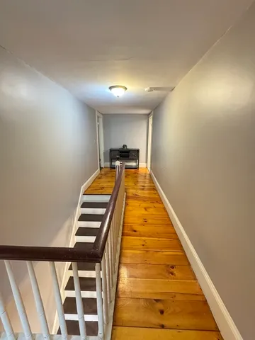 a view of a house with a chairs and table in a patio