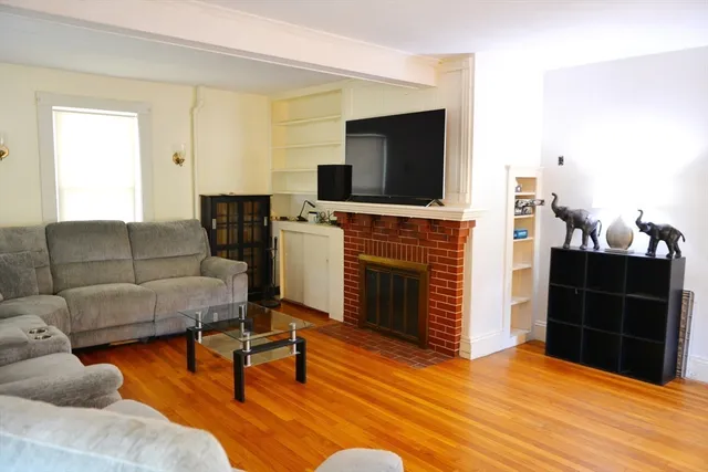 a kitchen with stainless steel appliances granite countertop wooden floors and sink