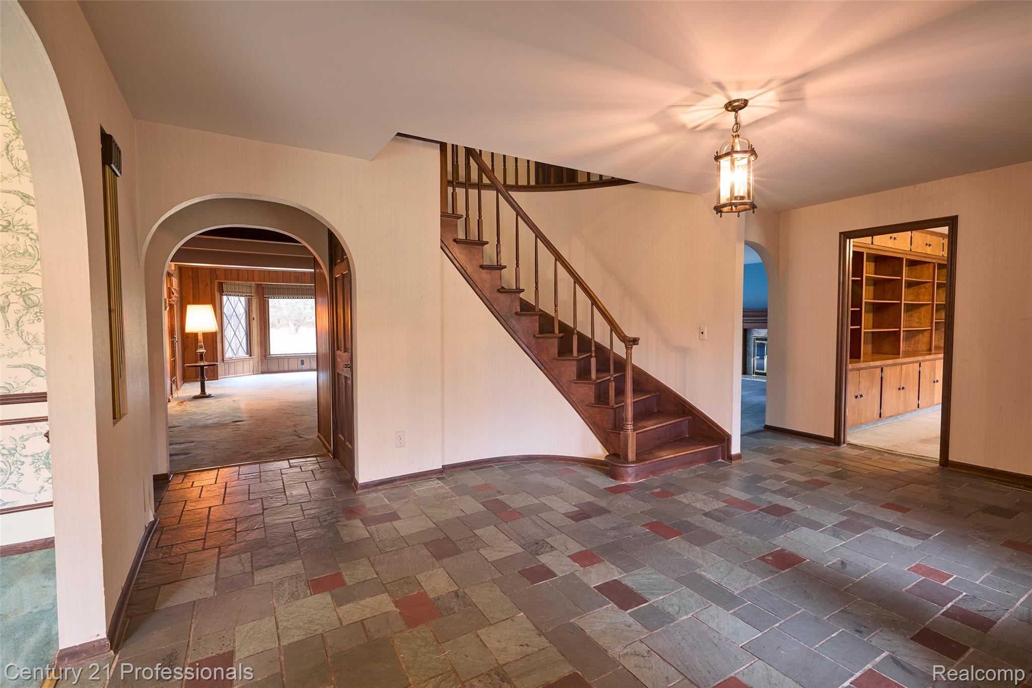 303 East Snell Road Rochester, MI 48306 - Photo 7 of 45 Foyer featuring slate flooring and arched walkways