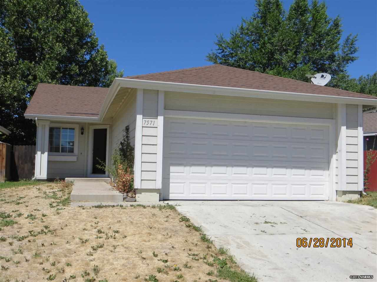 7571 Water View Way Reno, NV 89511 - Photo 1 of 1 a front view of a house with a yard