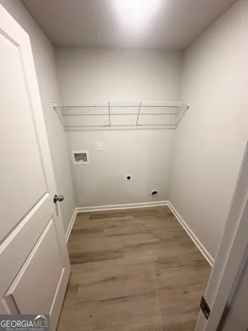 a view of a room with racks on the wall