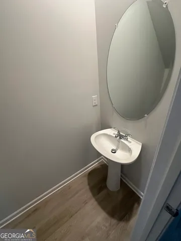 a bathroom with a sink and mirror