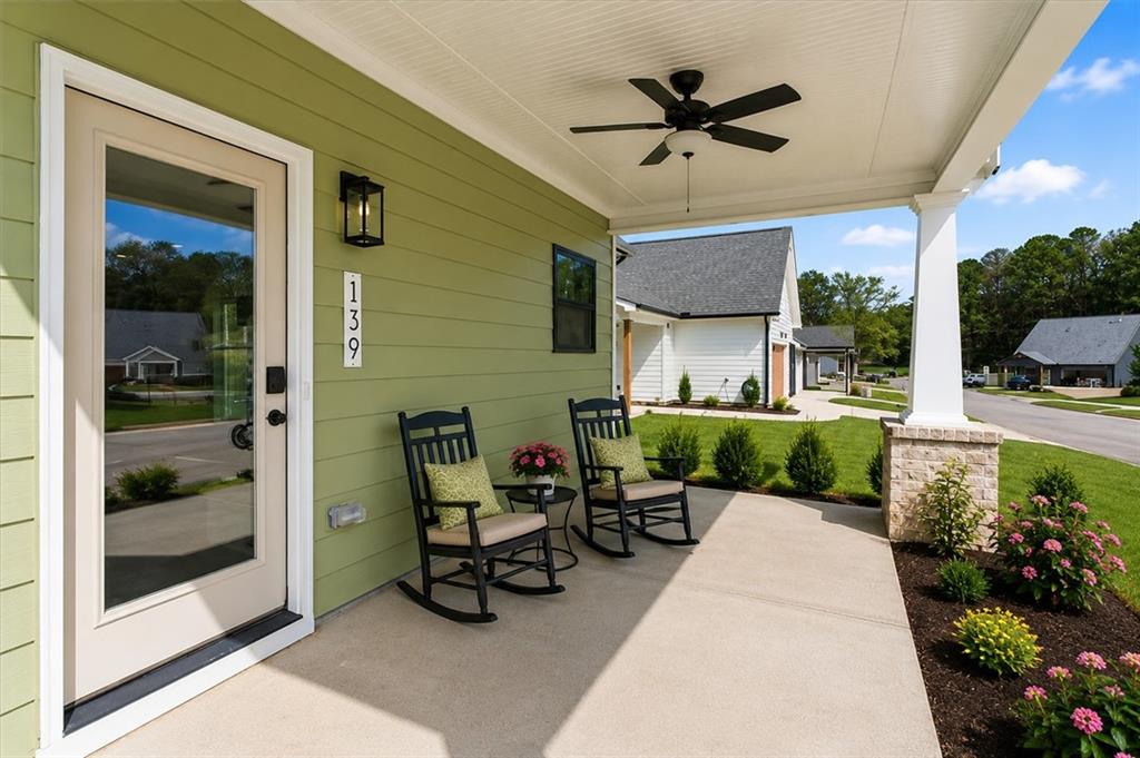 139 Old Alabama Road Southeast Emerson, GA 30137 - Photo 42 of 50 a view of a patio with a table and chairs under an umbrella