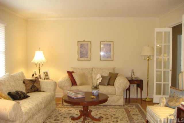 3309 Harden Road Raleigh, NC 27607 - Photo 2 of 10 a living room with furniture and a lamp