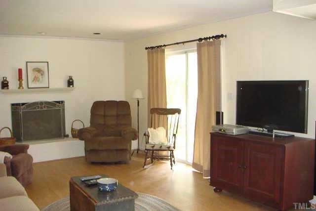 3309 Harden Road Raleigh, NC 27607 - Photo 5 of 10 a living room with furniture and a flat screen tv